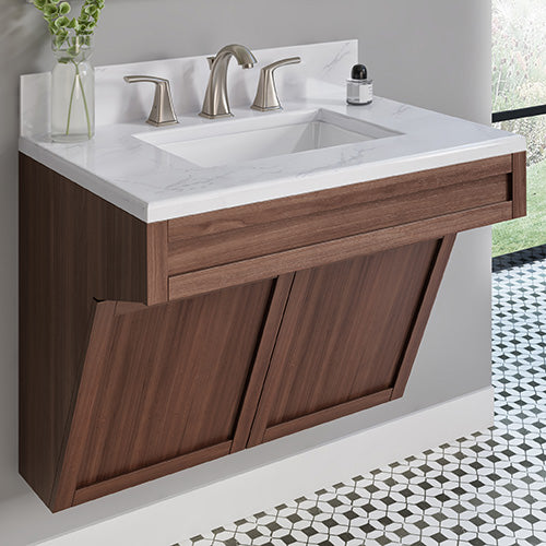 A beautiful two-handle bathroom faucet paired with a white porcelain sink, set atop a wooden vanity.