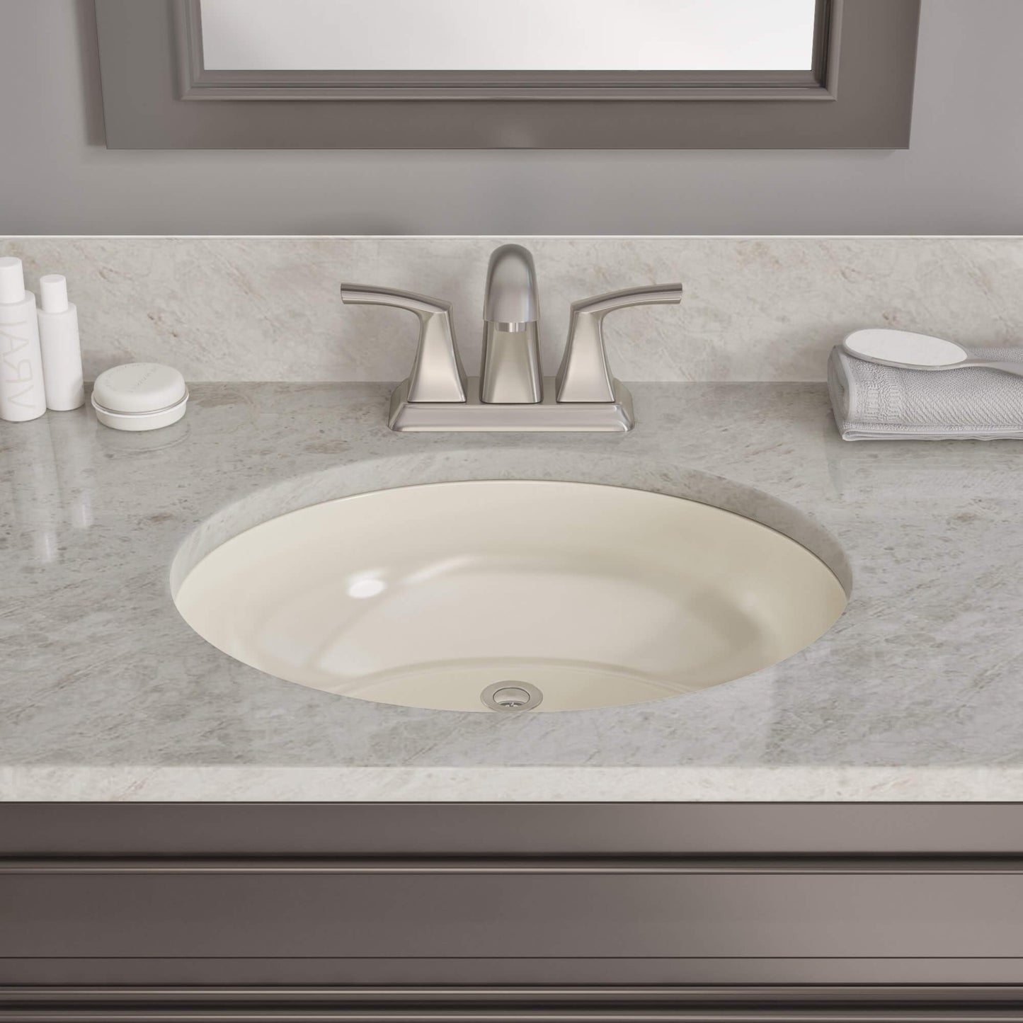 The elegant beauty of marble granite enhances a bathroom featuring a two-handle faucet paired with an undermount white sink