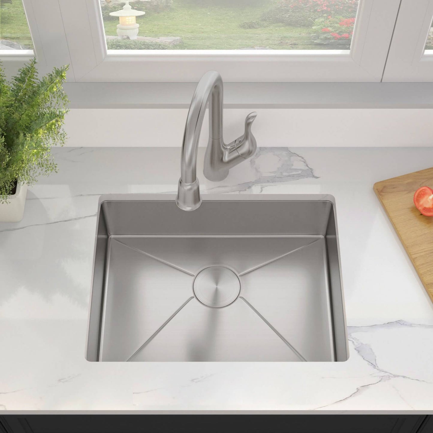 A pull out faucet is mounted over an ADA Kitchen Sink