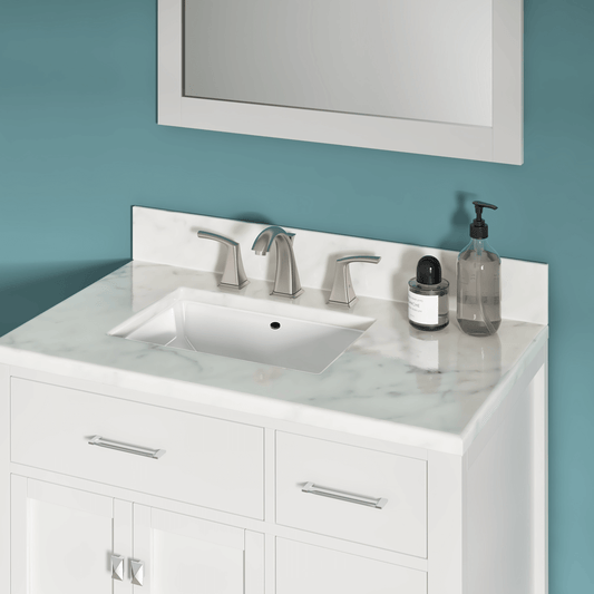 An exquisite faucet is installed on an undermount sink enhancing the beauty of the bathroom